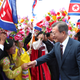South Korean president Moon Jae-in, right, is greeted by North Korean people during a welcome ceremony at the Sunan International Airport in Pyongyang.